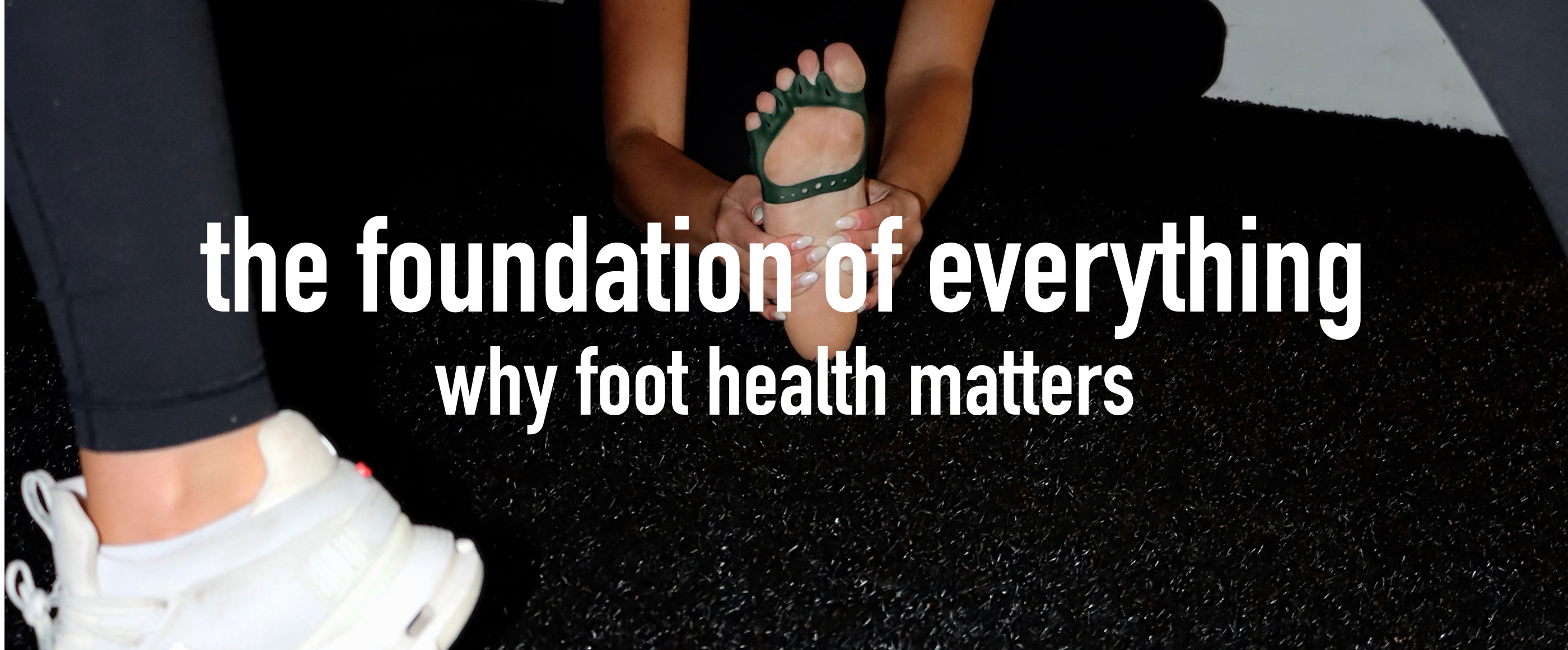 Person wearing white sneakers with text 'the foundation of everything why foot health matters' on a black background
